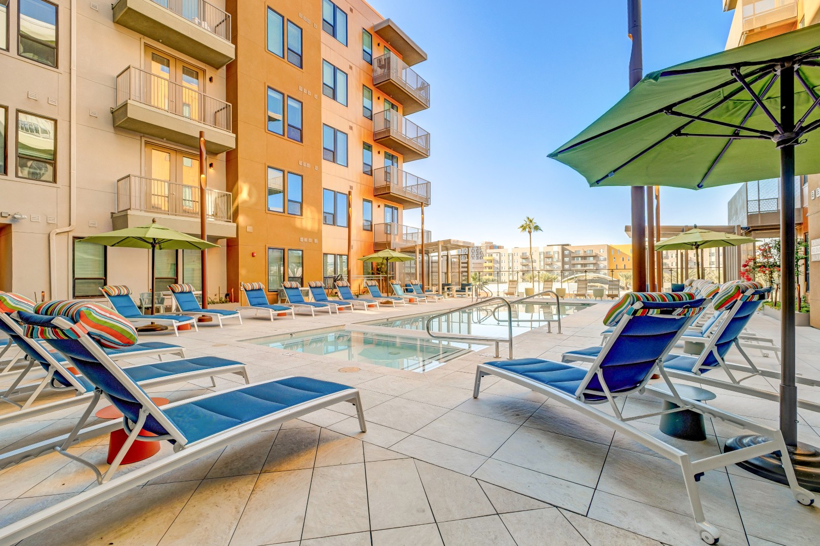 Poolside Seating With Umbrellas
