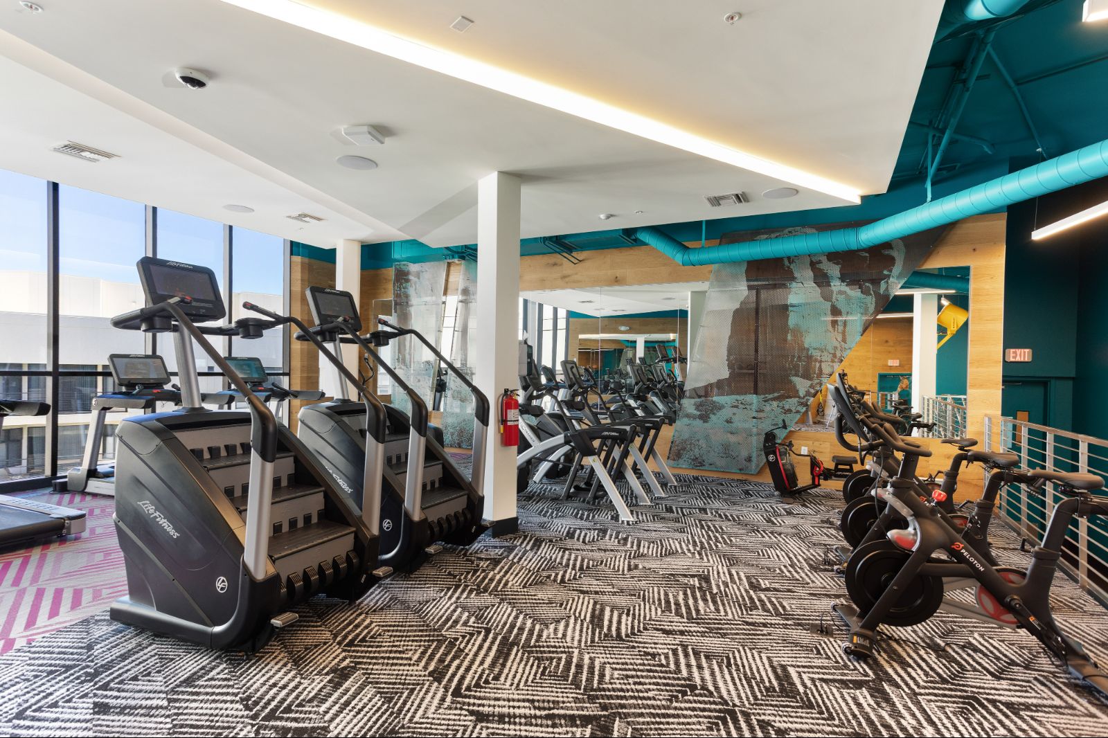 Luxury Fitness Center Machines Including Stair Steppers and Stationary Bikes