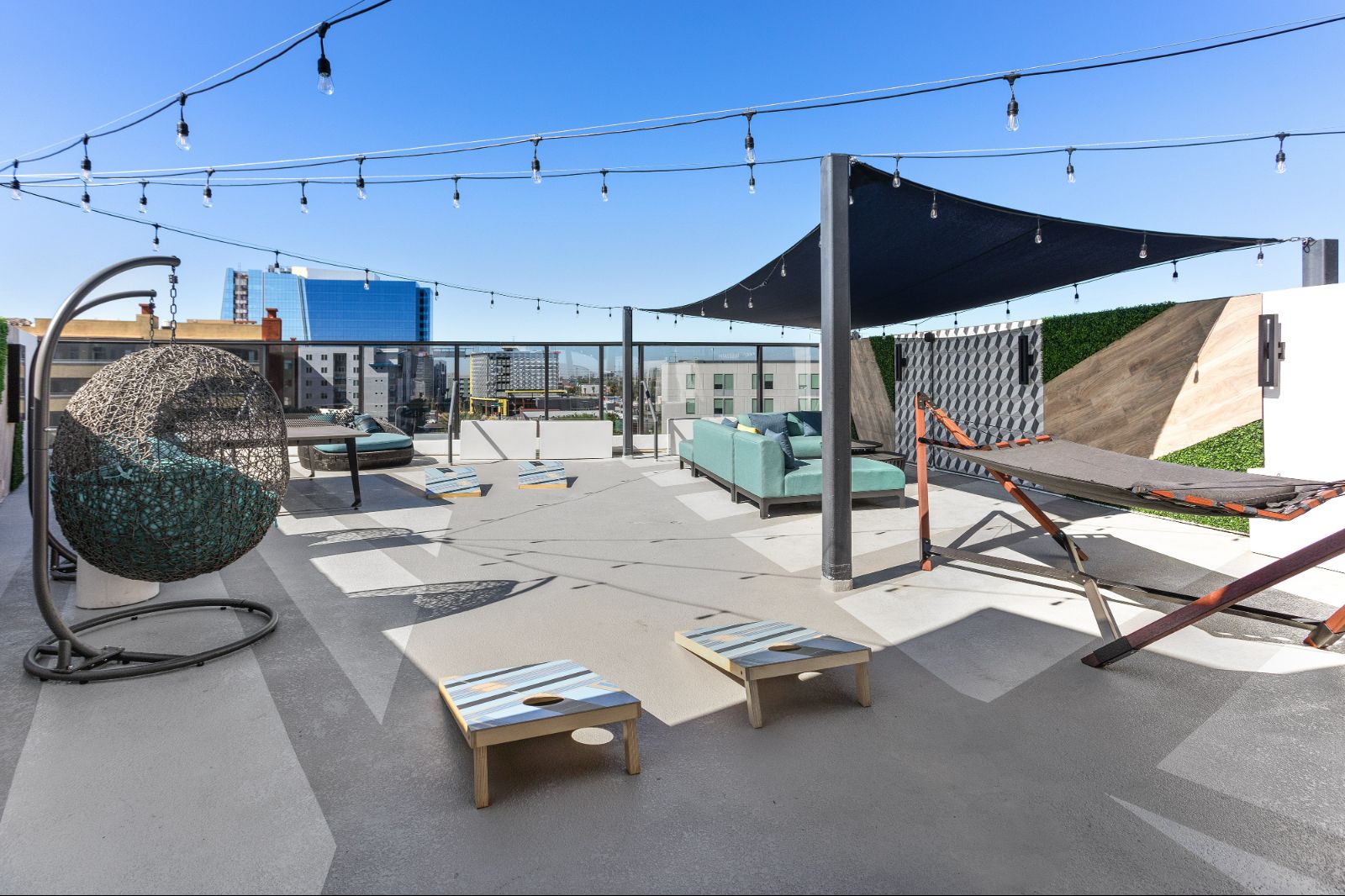 Outdoor Game Area with Cornhole, Hammocks, and Loungers