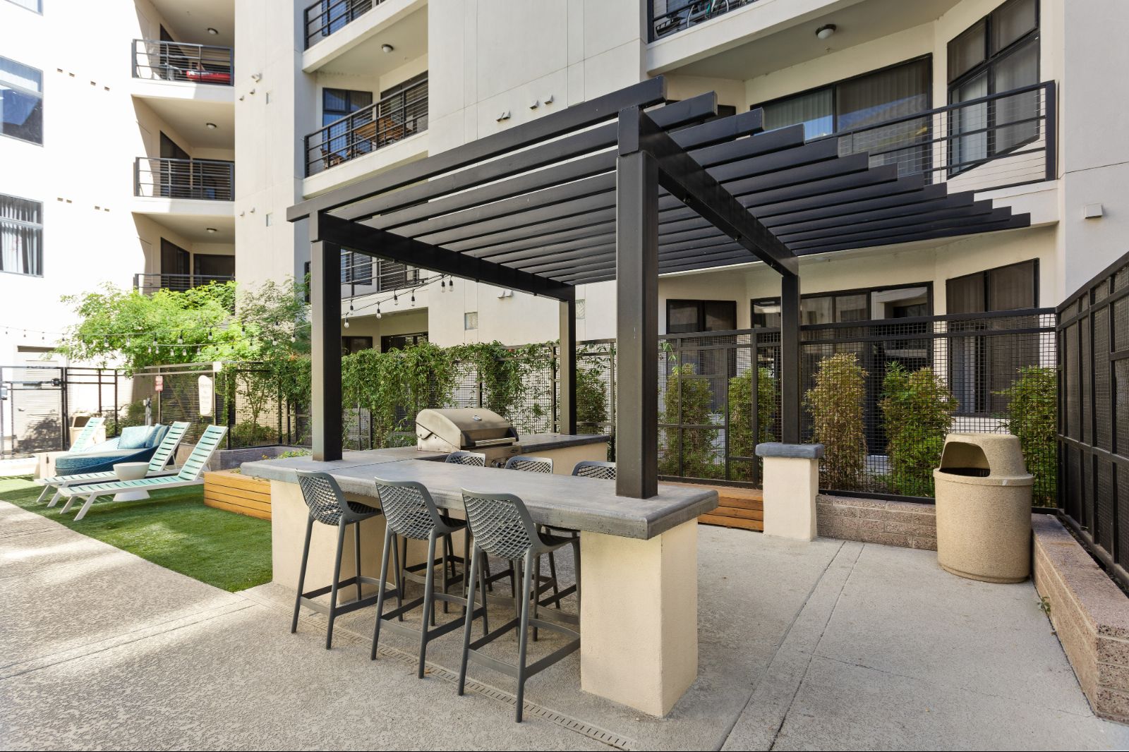 Outdoor Grilling Stations with Pergola and Sun Chairs